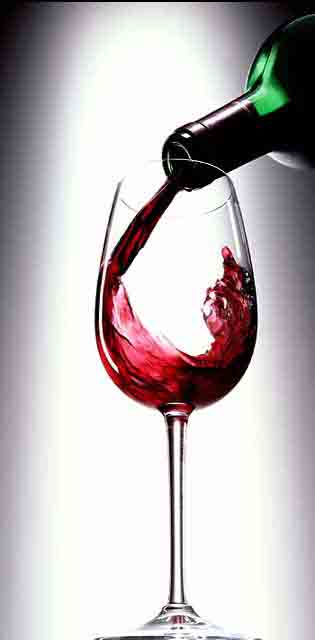 red wine pouring into glass red red wine